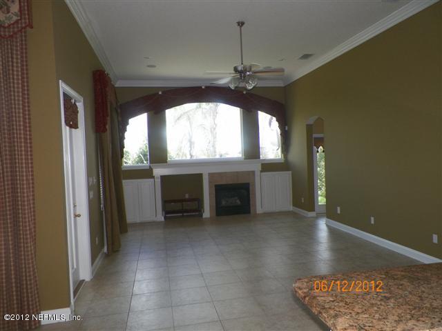 2000 River's Own Road St. Augustine, FL 32092 - Photo 16 of 36 an empty room with windows and ceiling fan