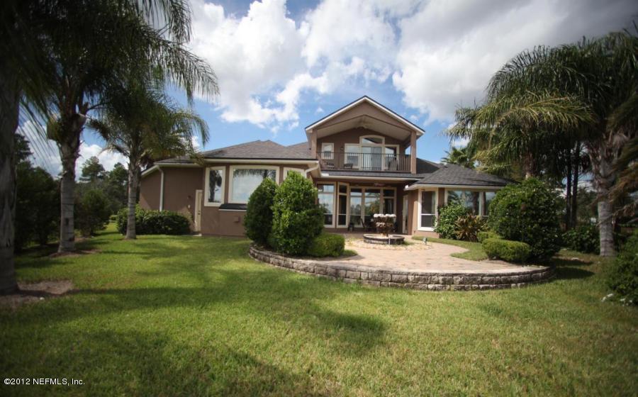 2000 River's Own Road St. Augustine, FL 32092 - Photo 2 of 36 a front view of a house with a garden
