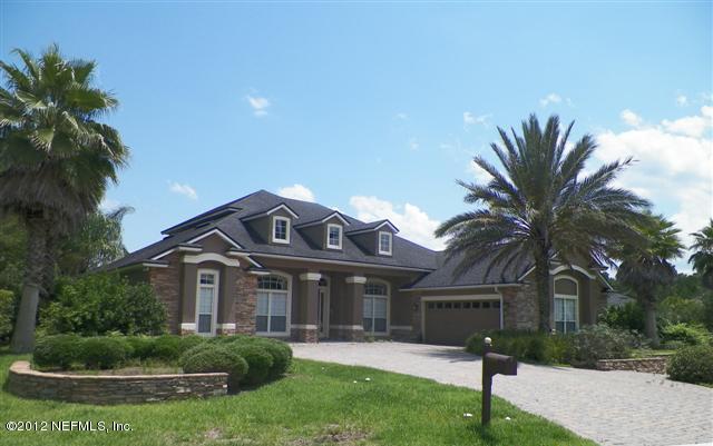 2000 River's Own Road St. Augustine, FL 32092 - Photo 30 of 36 a front view of a house with a yard and potted plants