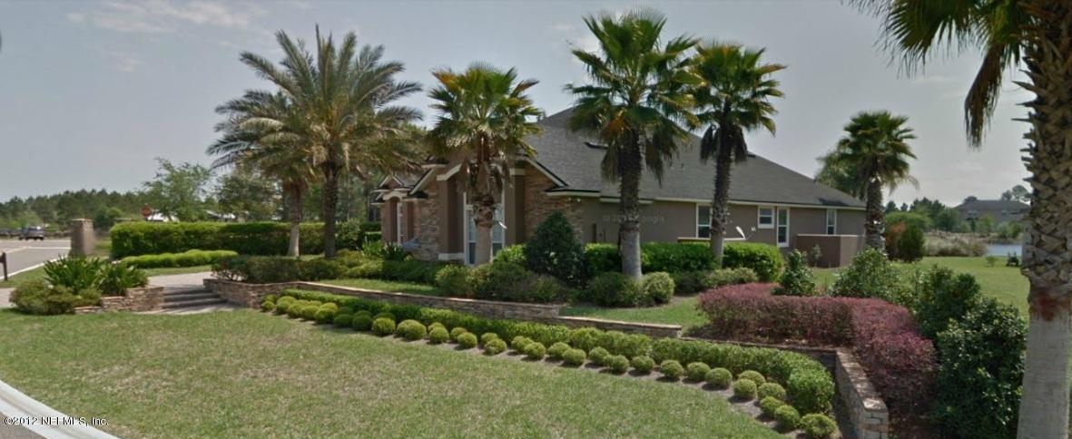2000 River's Own Road St. Augustine, FL 32092 - Photo 3 of 36 a front view of a house with a garden