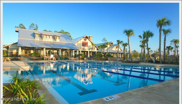 2000 River's Own Road St. Augustine, FL 32092 - Photo 35 of 36 a view of a swimming pool with a table and chairs