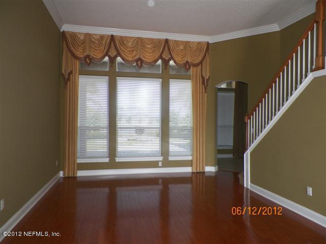 2000 River's Own Road St. Augustine, FL 32092 - Photo 4 of 36 a view of an empty room with wooden floor and a window
