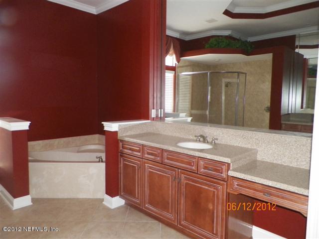 2000 River's Own Road St. Augustine, FL 32092 - Photo 9 of 36 a bathroom with a sink and a mirror