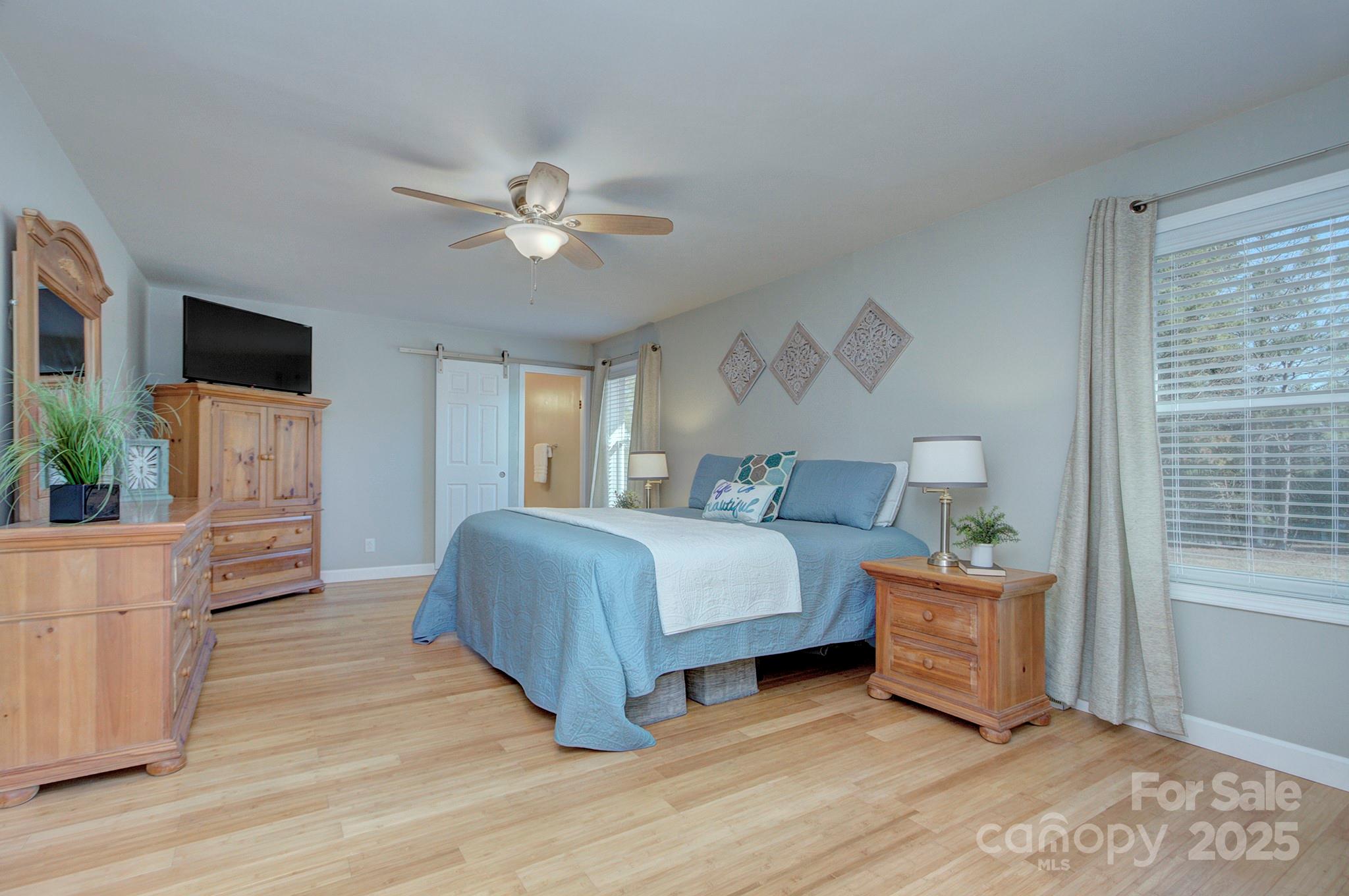 1615 Deer Run Road Catawba, SC 29704 - Photo 15 of 31 a spacious bedroom with a bed and a flat screen tv