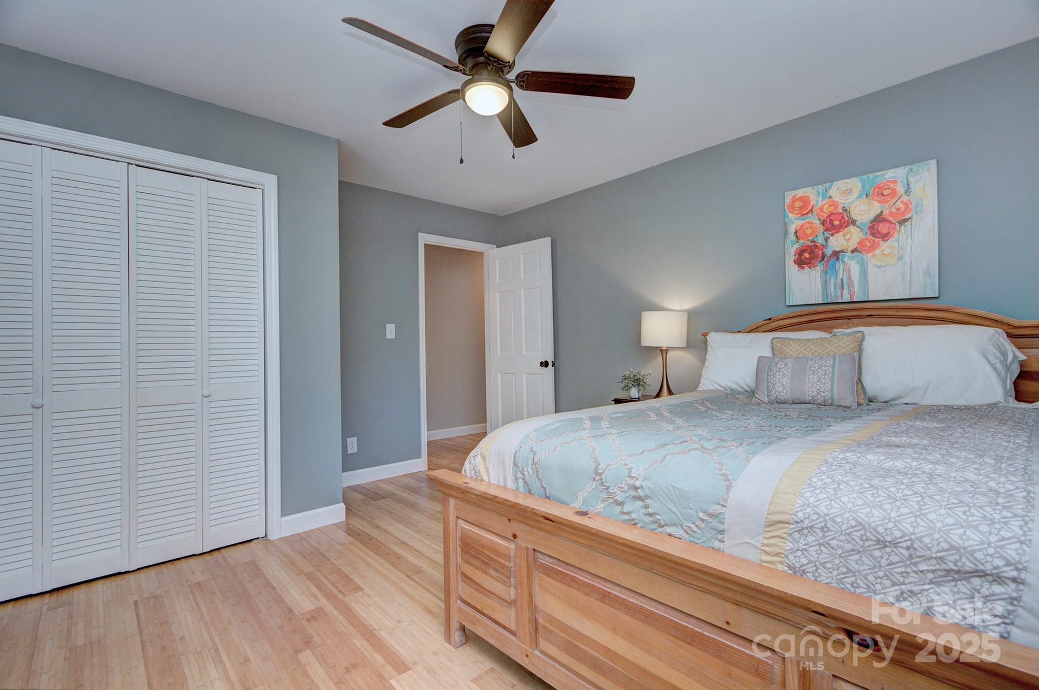 1615 Deer Run Road Catawba, SC 29704 - Photo 20 of 31 a bedroom with a bed and a chandelier
