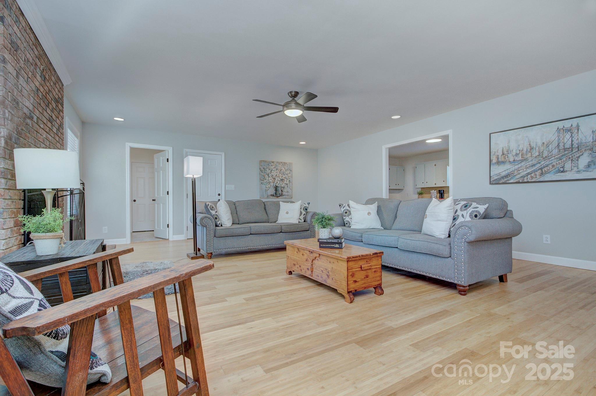 1615 Deer Run Road Catawba, SC 29704 - Photo 8 of 31 a living room with furniture and a chandelier