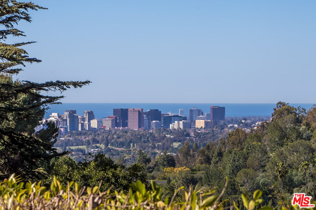 1106 North Hillcrest Road Beverly Hills, CA 90210 - Photo 4 of 54 a view of a city with tall buildings