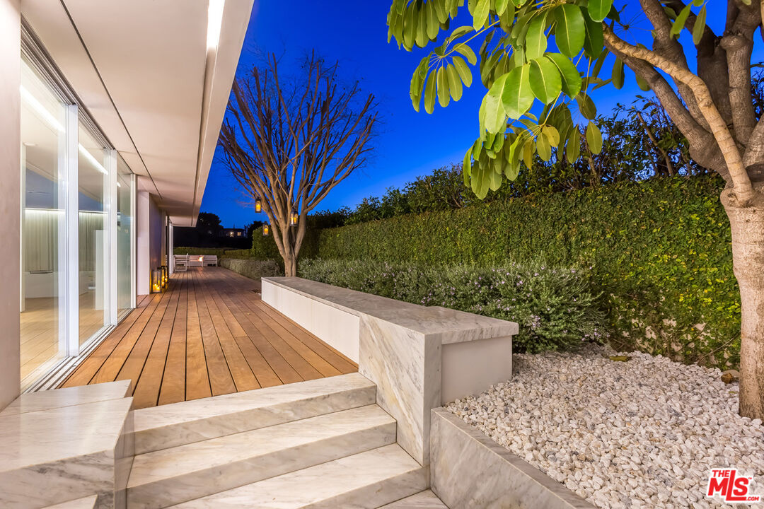 1106 North Hillcrest Road Beverly Hills, CA 90210 - Photo 47 of 54 a view of backyard with deck and outdoor seating