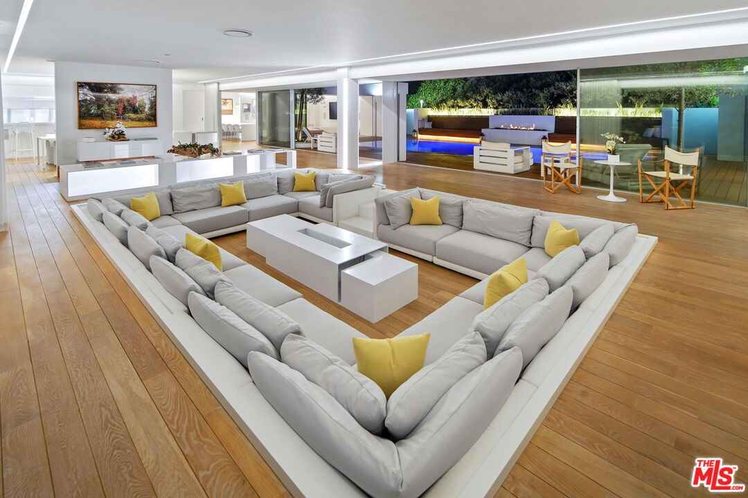 1106 North Hillcrest Road Beverly Hills, CA 90210 - Photo 48 of 54 a living room with furniture and a table