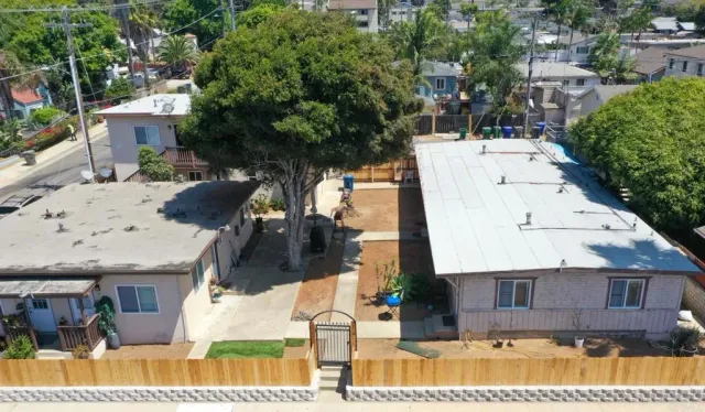 an aerial view of a house with a yard