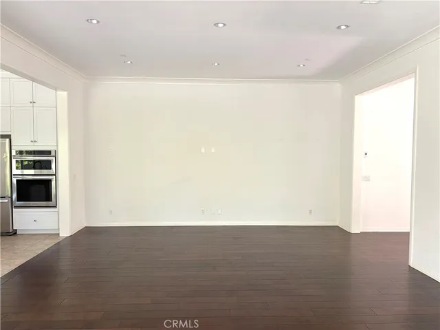 a view of a kitchen with wooden floor
