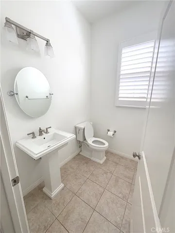 a bathroom with a toilet a sink and bathtub