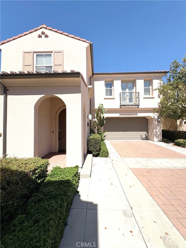 89 Field Poppy Irvine, CA 92620 - Photo 2 of 37 a front view of a house with a yard