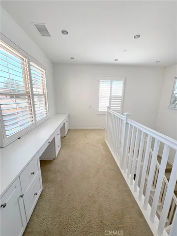 a view of a hallway with stairs
