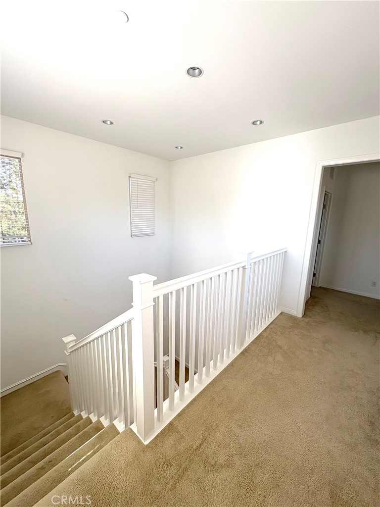 89 Field Poppy Irvine, CA 92620 - Photo 23 of 37 a view of a hallway with stairs