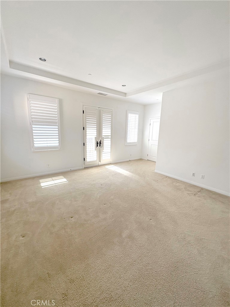 89 Field Poppy Irvine, CA 92620 - Photo 28 of 37 an empty room with windows and mirror