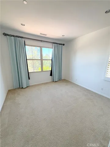 a large bathroom with a double vanity sink and a mirror