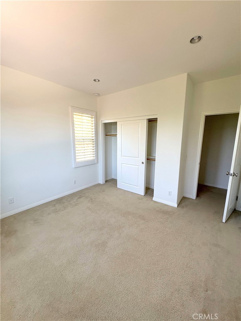 89 Field Poppy Irvine, CA 92620 - Photo 32 of 37 an empty room with windows and closet