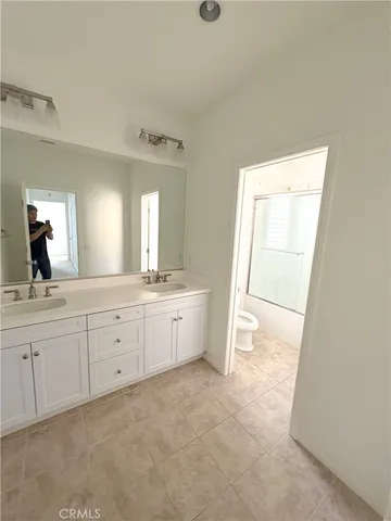 a kitchen with a stove a sink and a microwave