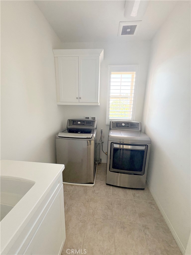 89 Field Poppy Irvine, CA 92620 - Photo 35 of 37 a kitchen with a stove a sink and a microwave