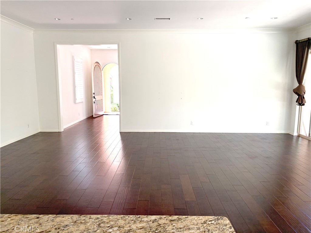 89 Field Poppy Irvine, CA 92620 - Photo 7 of 37 a view of a room with wooden floor
