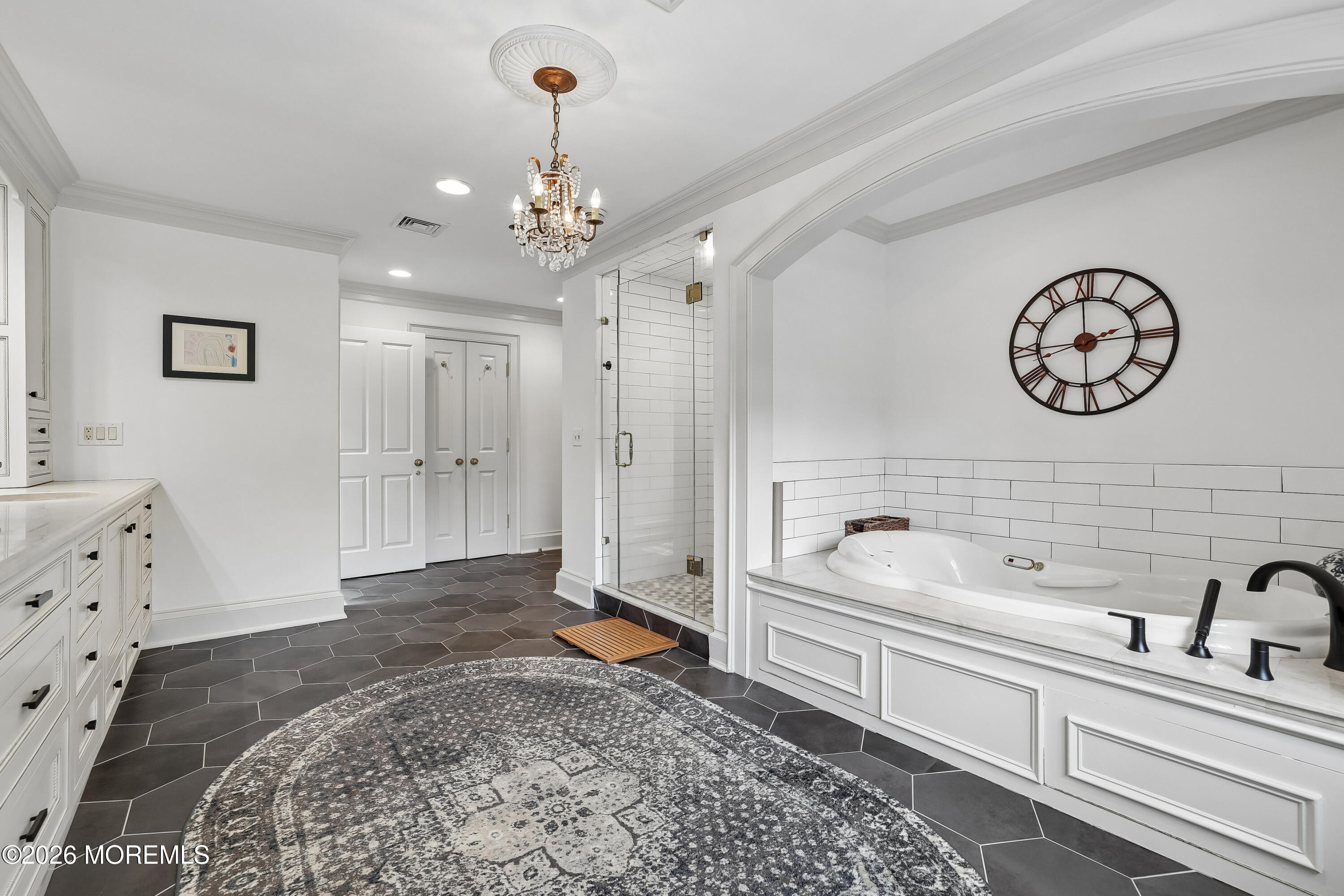 92 Tulip Lane Colts Neck, NJ 07722 - Photo 24 of 55 a spacious bathroom with a sink a mirror and a bathtub
