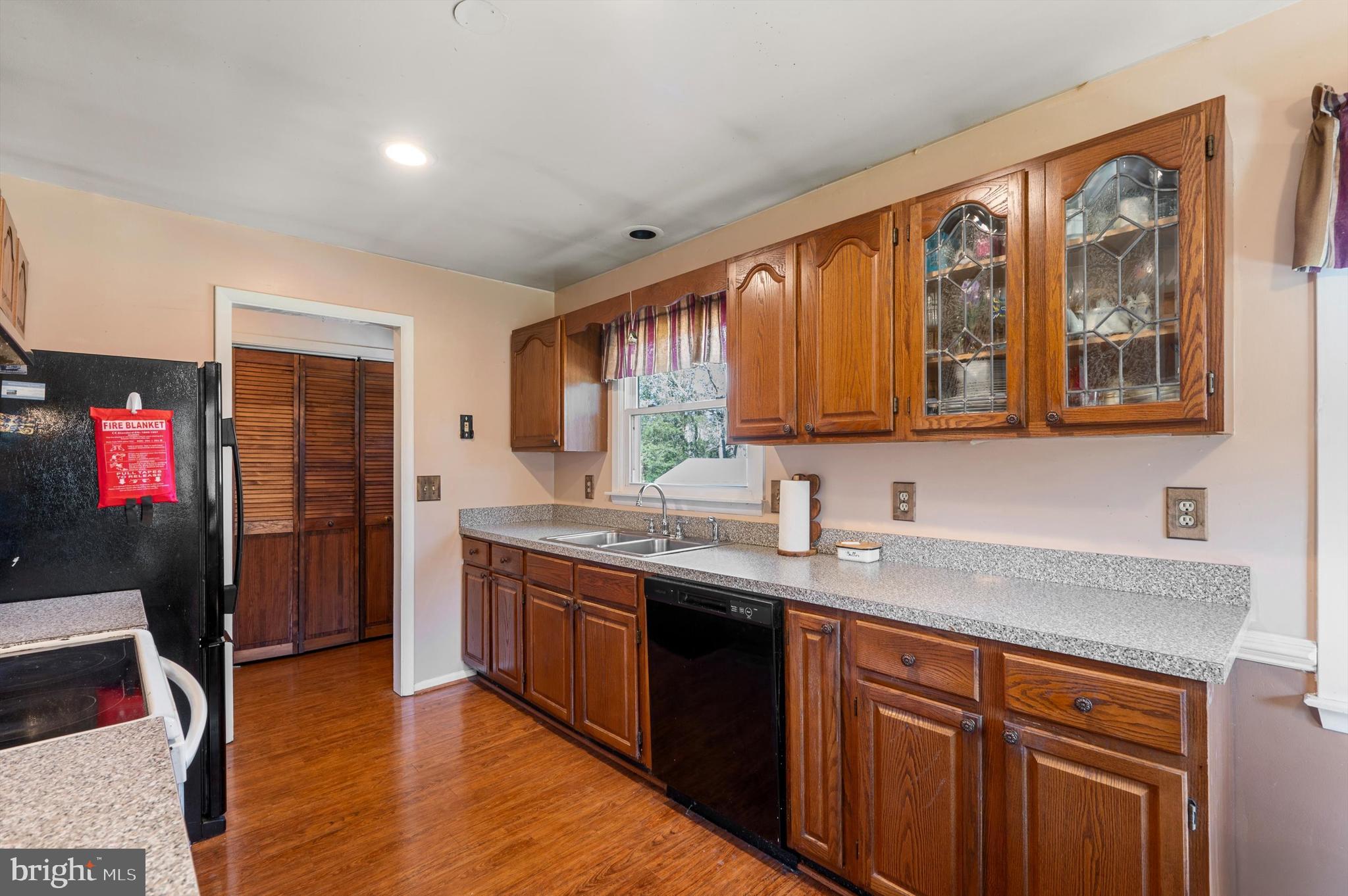 6521 Howellsville Road Front Royal, VA 22630 - Photo 12 of 46 a kitchen with stainless steel appliances granite countertop a sink stove and refrigerator