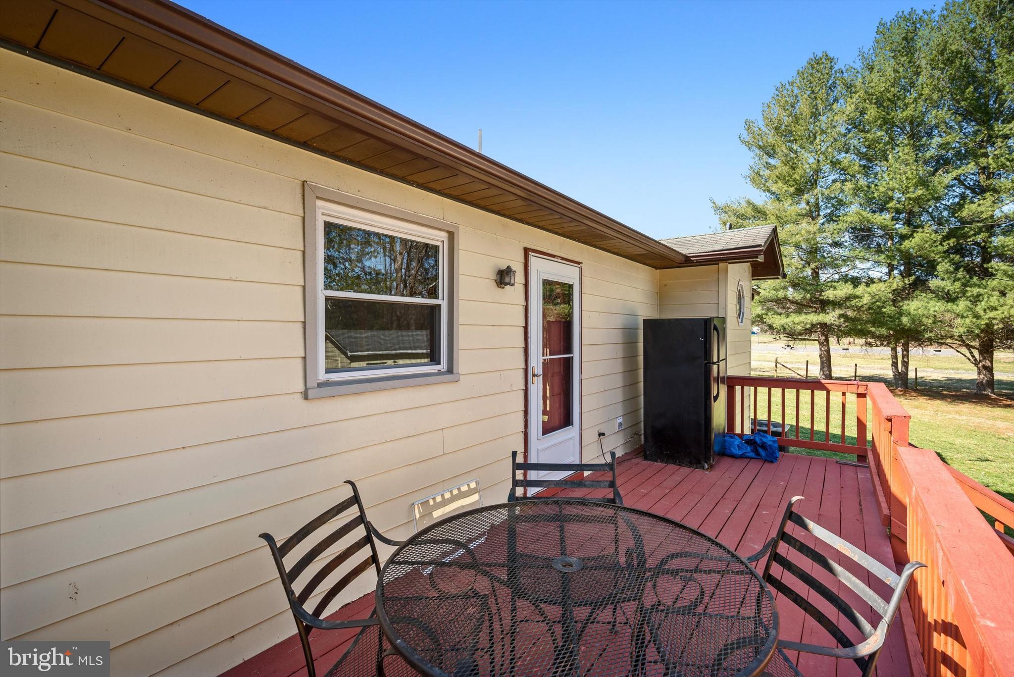 6521 Howellsville Road Front Royal, VA 22630 - Photo 14 of 46 a balcony with table and chairs