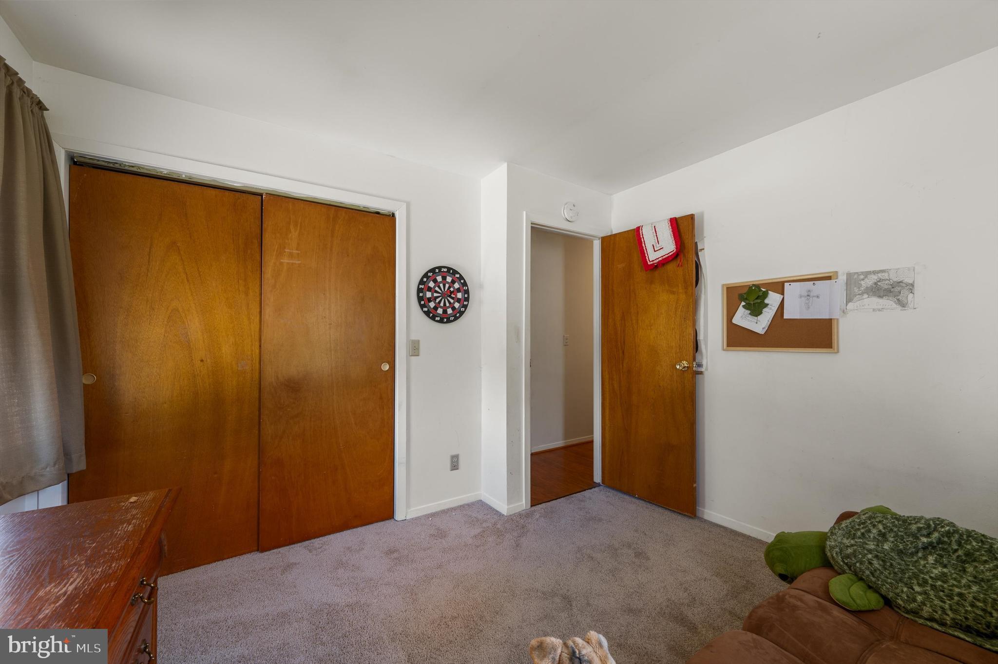 6521 Howellsville Road Front Royal, VA 22630 - Photo 19 of 46 a bedroom with a bed and wooden floor