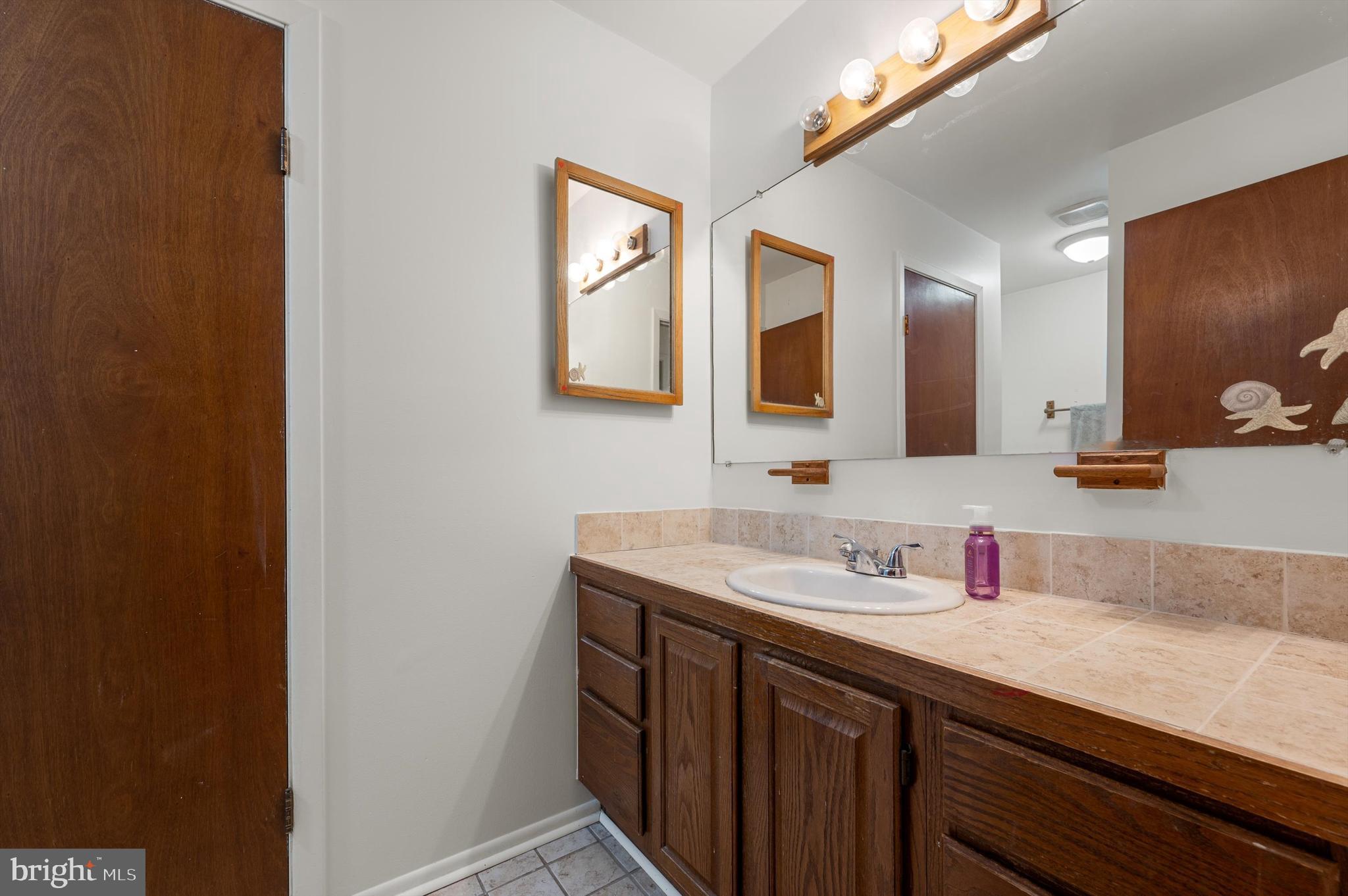 6521 Howellsville Road Front Royal, VA 22630 - Photo 22 of 46 a bathroom with a sink and a mirror