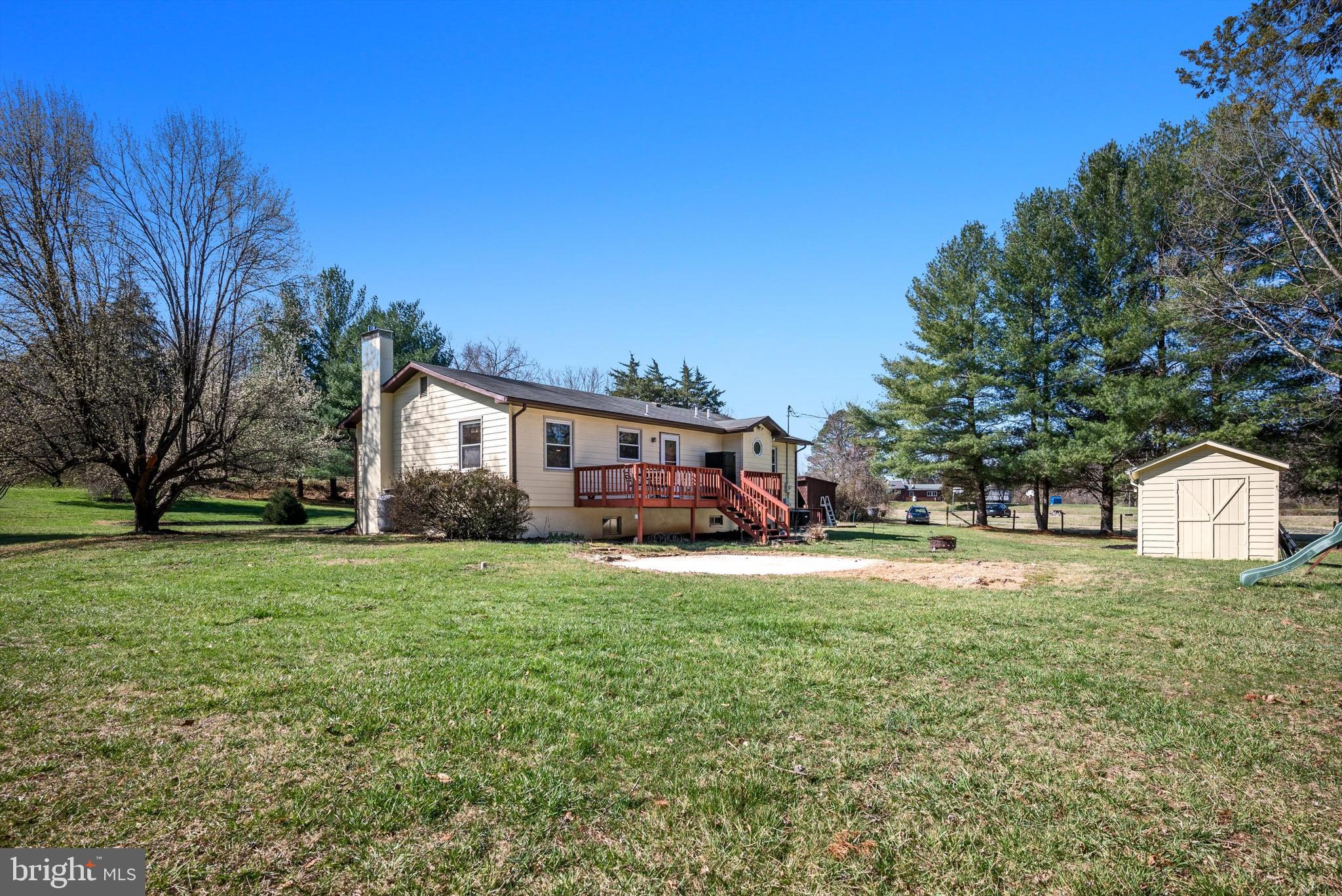 6521 Howellsville Road Front Royal, VA 22630 - Photo 34 of 46 a front view of a house with a yard