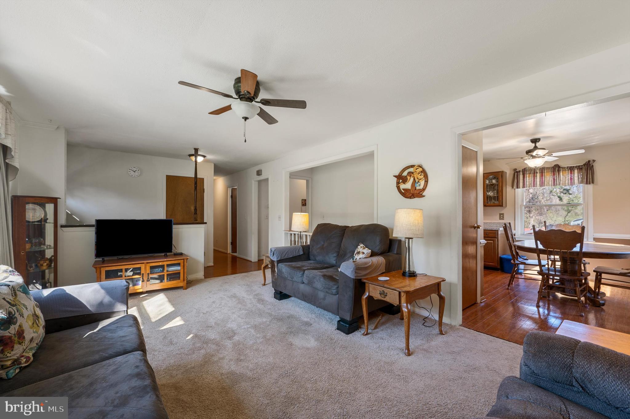 6521 Howellsville Road Front Royal, VA 22630 - Photo 4 of 46 a living room with furniture and a flat screen tv