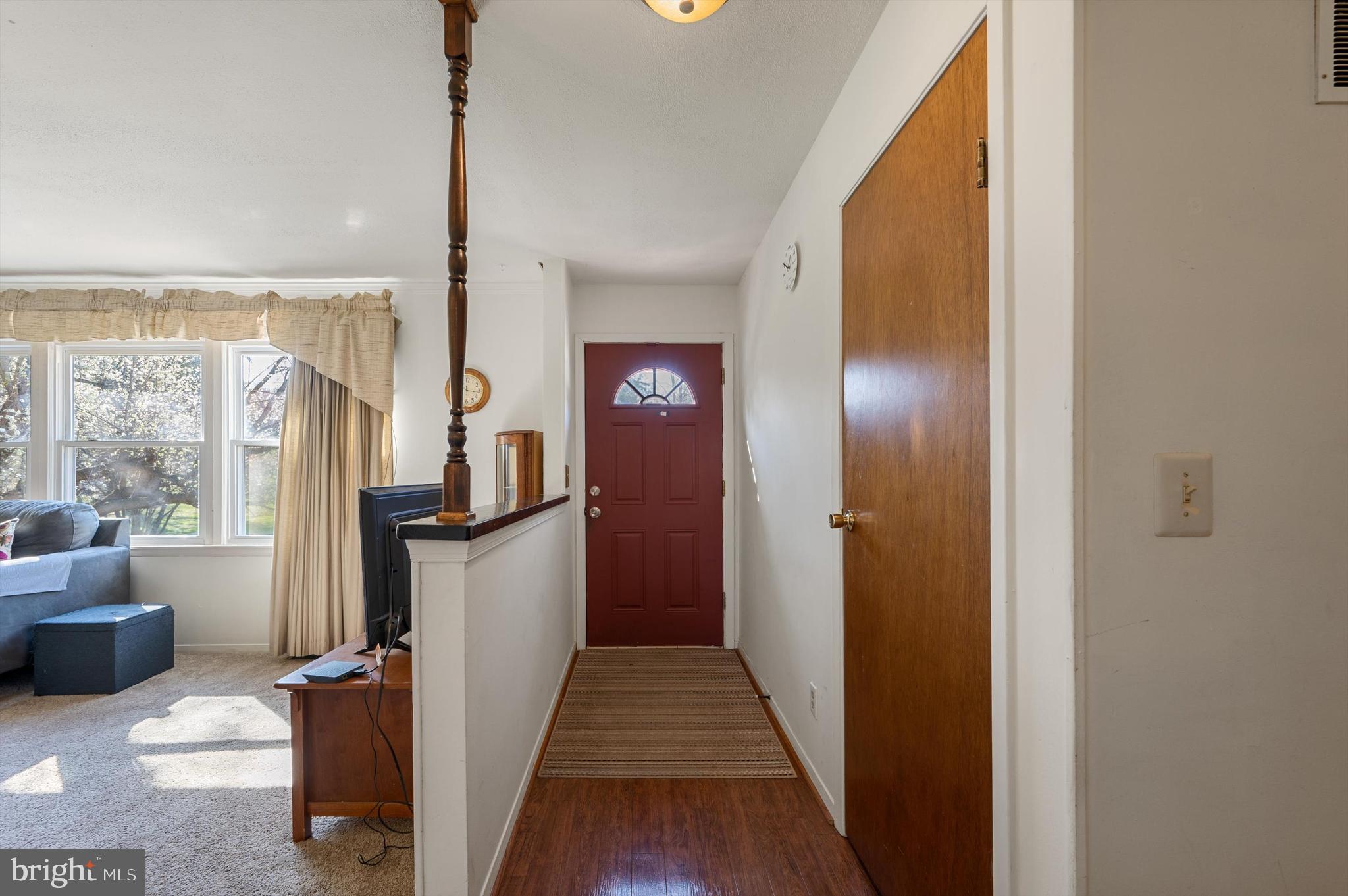 6521 Howellsville Road Front Royal, VA 22630 - Photo 6 of 46 a view of a hallway with furniture and windows