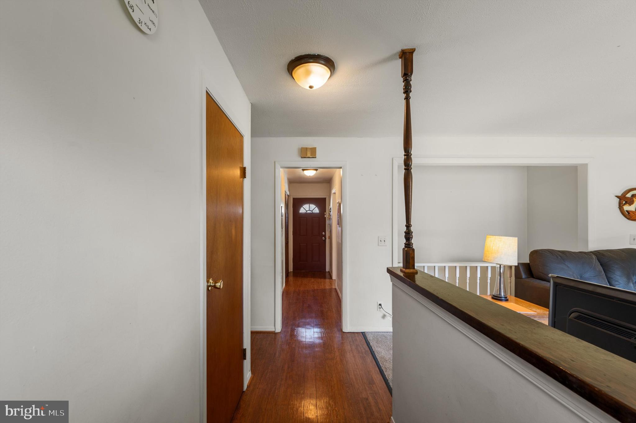 6521 Howellsville Road Front Royal, VA 22630 - Photo 7 of 46 a hallway with front door wooden floor and windows