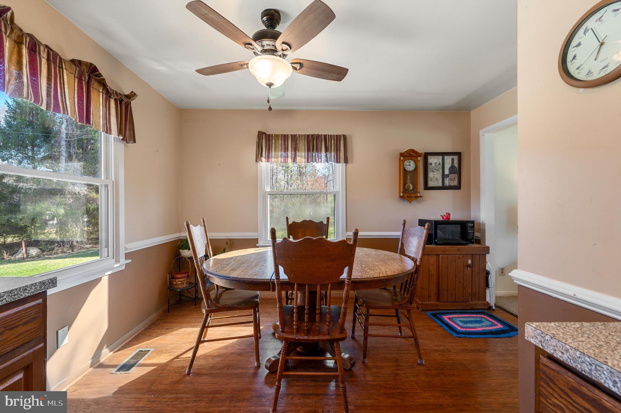 6521 Howellsville Road Front Royal, VA 22630 - Photo 9 of 46 a view of a dining room with furniture window and wooden floor