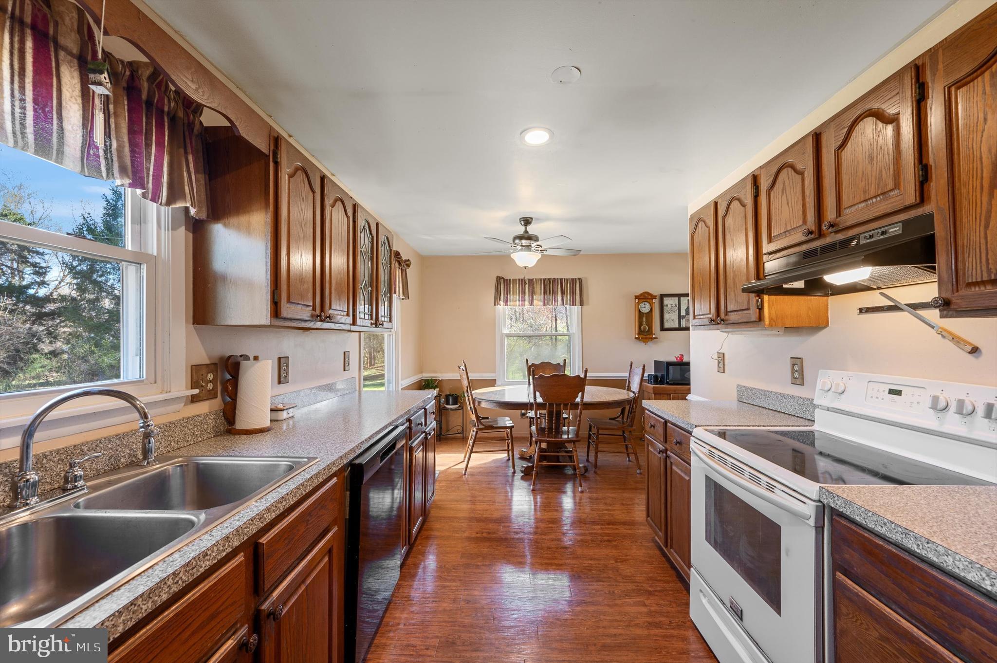6521 Howellsville Road Front Royal, VA 22630 - Photo 10 of 46 a kitchen with stainless steel appliances granite countertop a sink dishwasher stove and oven
