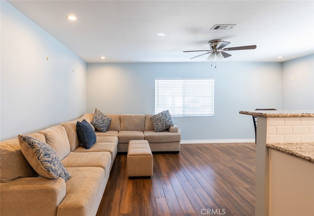 5512 Marcella Avenue Cypress, CA 90630 - Photo 19 of 39 a living room with furniture and a window