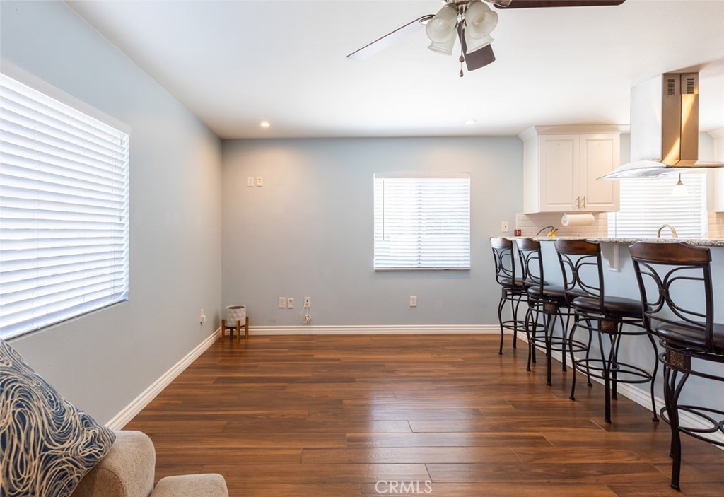 5512 Marcella Avenue Cypress, CA 90630 - Photo 21 of 39 a view of a dining room with furniture and wooden floor
