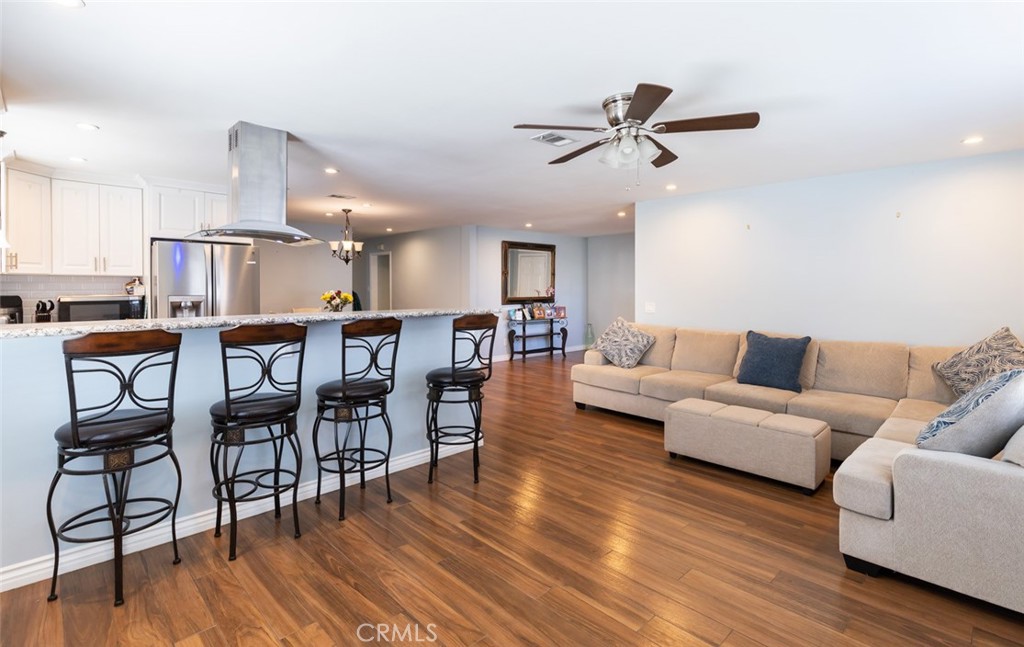 5512 Marcella Avenue Cypress, CA 90630 - Photo 22 of 39 a living room with furniture and wooden floor