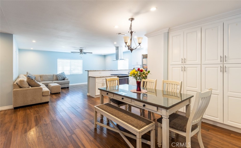 5512 Marcella Avenue Cypress, CA 90630 - Photo 25 of 39 a view of a dining room with furniture and wooden floor
