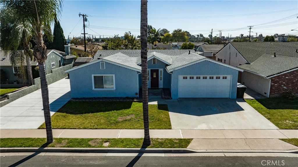 5512 Marcella Avenue Cypress, CA 90630 - Photo 3 of 39 a front view of a house with a yard