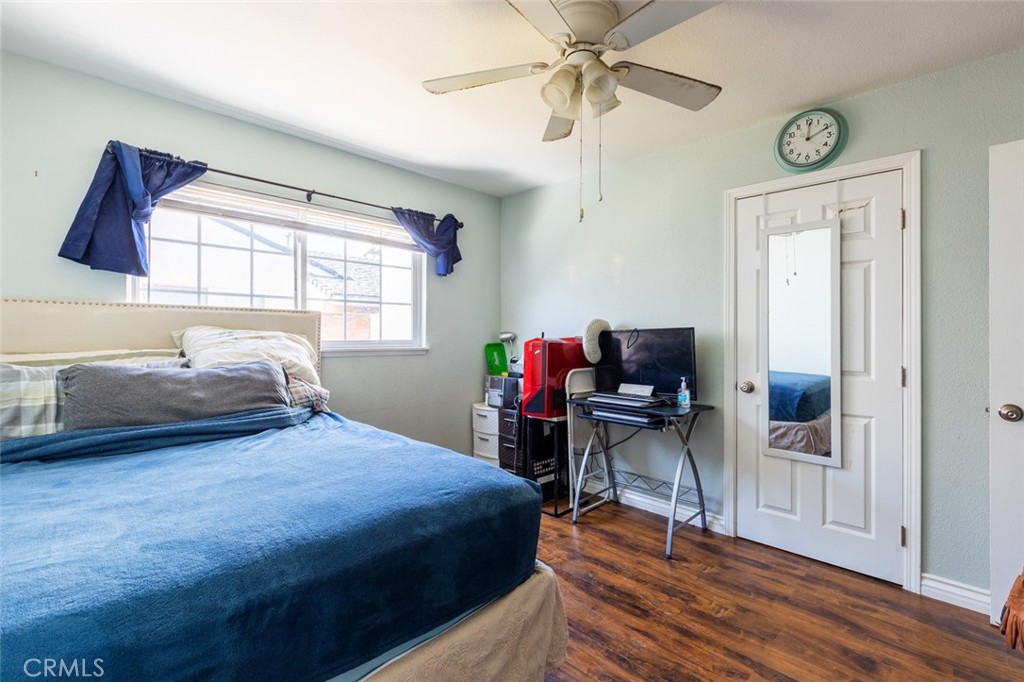 5512 Marcella Avenue Cypress, CA 90630 - Photo 32 of 39 a bedroom with a bed and a chandelier