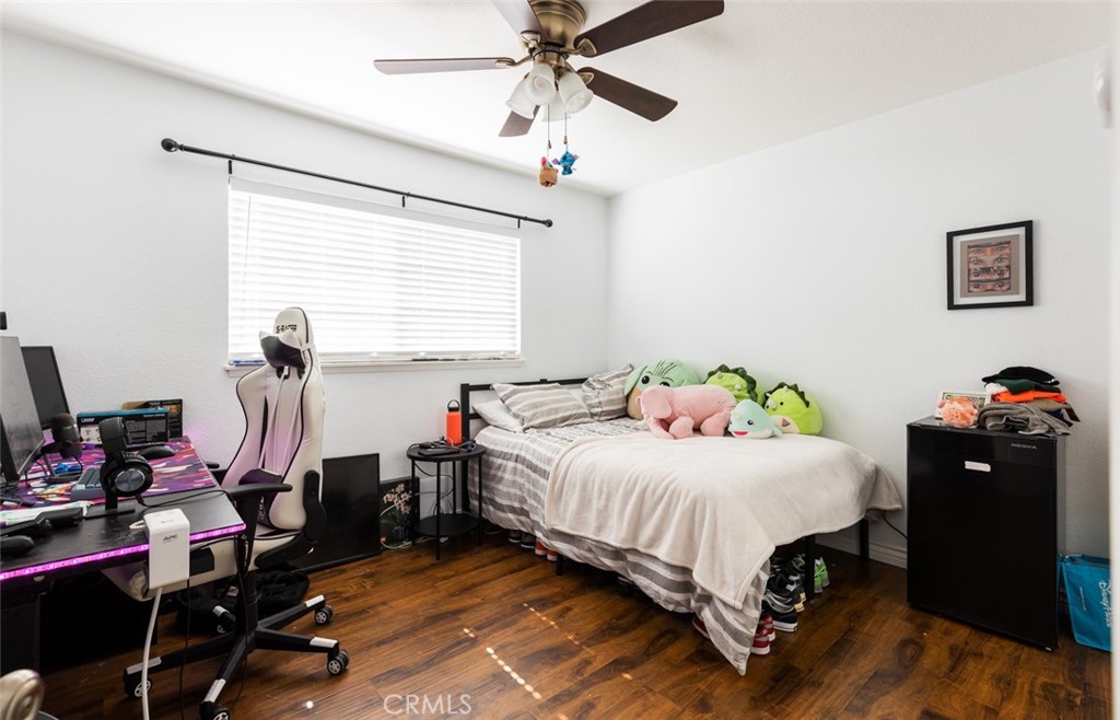 5512 Marcella Avenue Cypress, CA 90630 - Photo 34 of 39 a bedroom with a bed and dresser