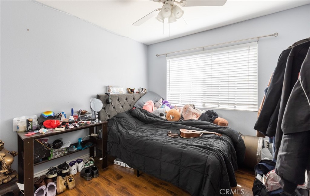 5512 Marcella Avenue Cypress, CA 90630 - Photo 35 of 39 a bed sitting in a bedroom next to a window