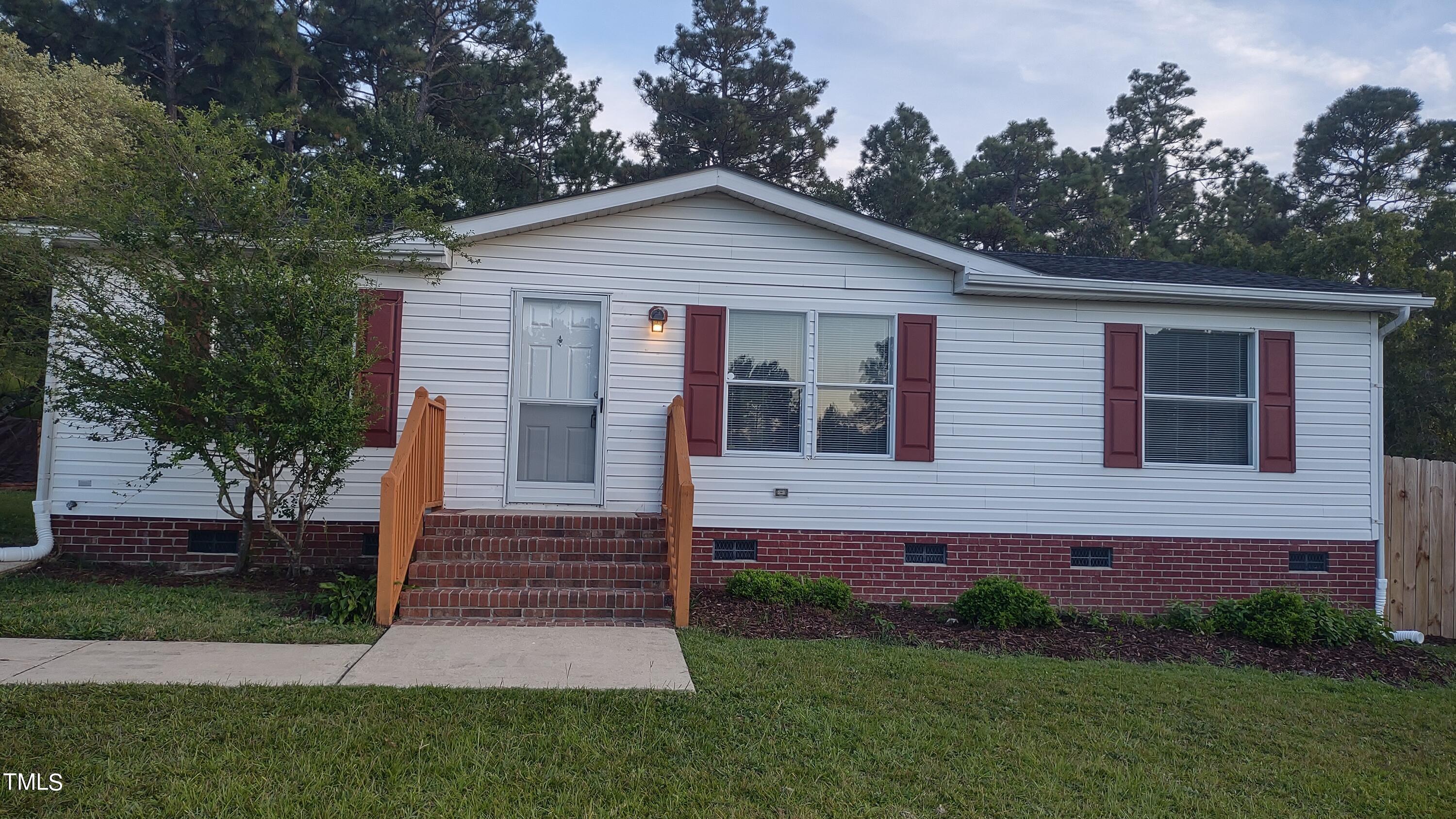 437 West Northpoint Road Spring Lake, NC 28390 - Photo 1 of 27 a view of front of a house with a yard