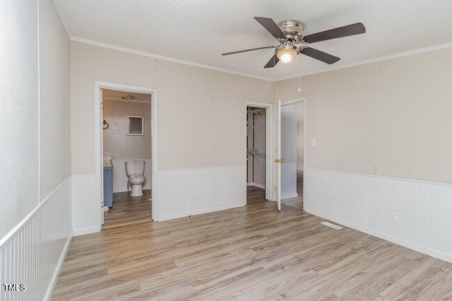 437 West Northpoint Road Spring Lake, NC 28390 - Photo 13 of 27 wooden floor in an empty room with a window