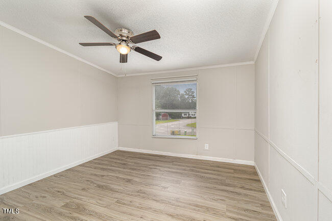 437 West Northpoint Road Spring Lake, NC 28390 - Photo 18 of 27 wooden floor in an empty room with a window