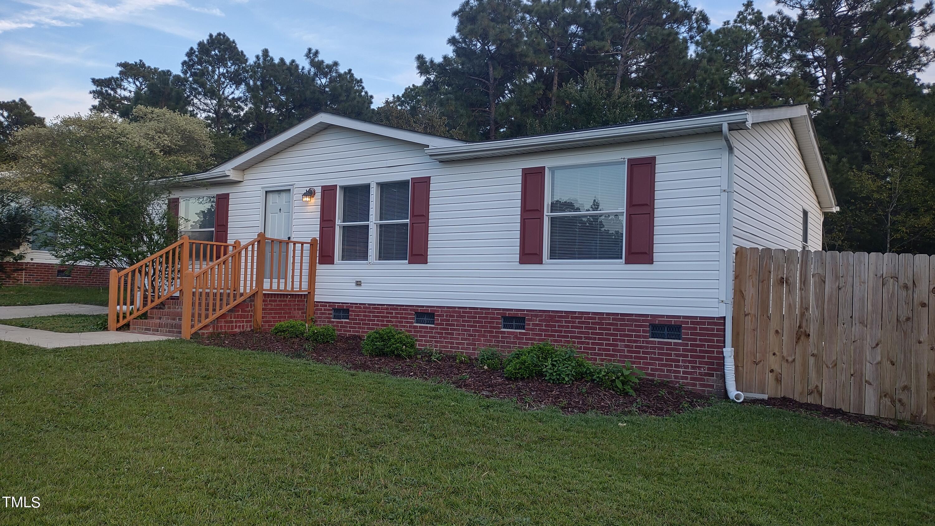 437 West Northpoint Road Spring Lake, NC 28390 - Photo 3 of 27 a view of a house with a yard