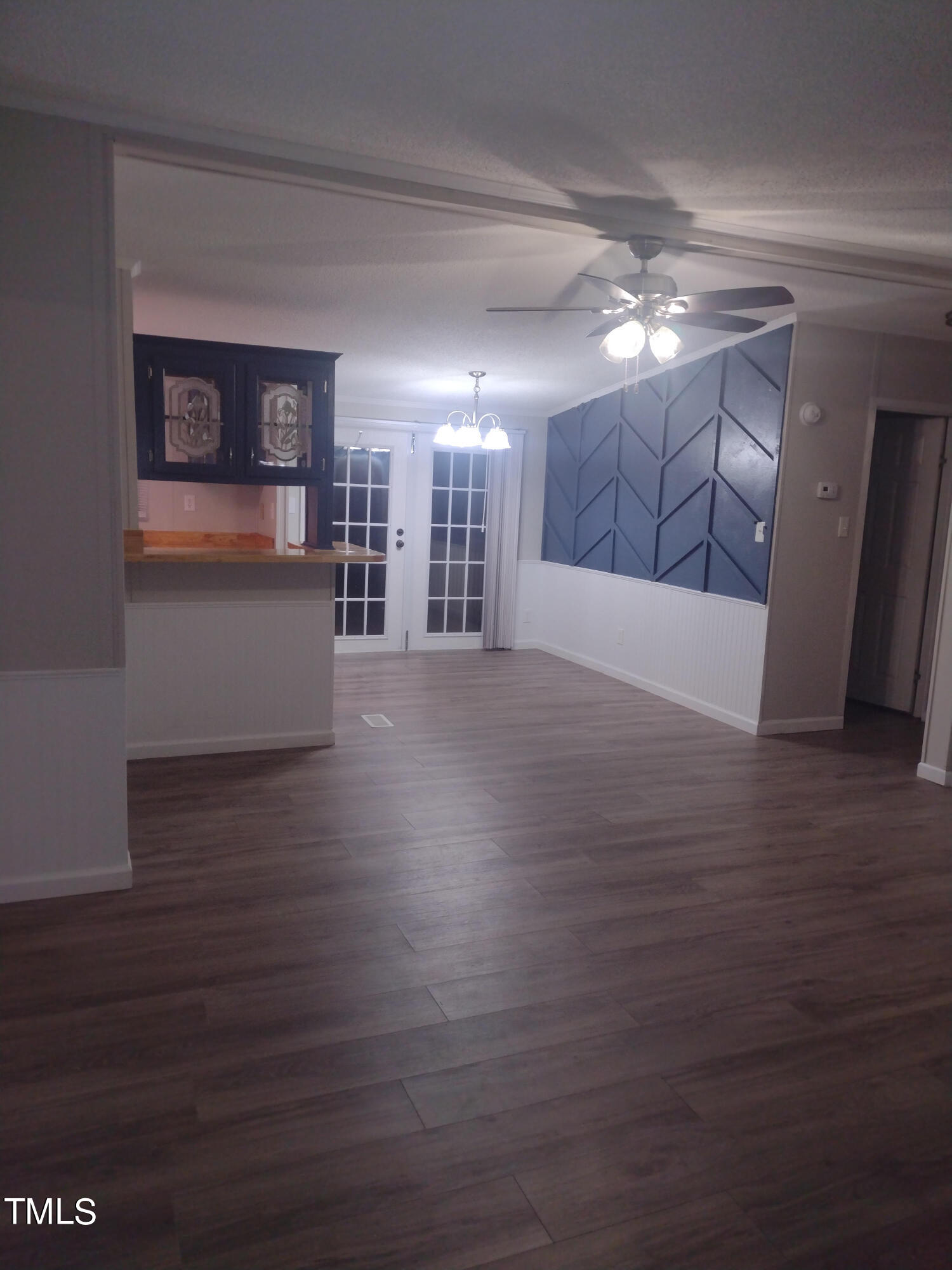 437 West Northpoint Road Spring Lake, NC 28390 - Photo 4 of 27 a view of a big room with wooden floor and windows