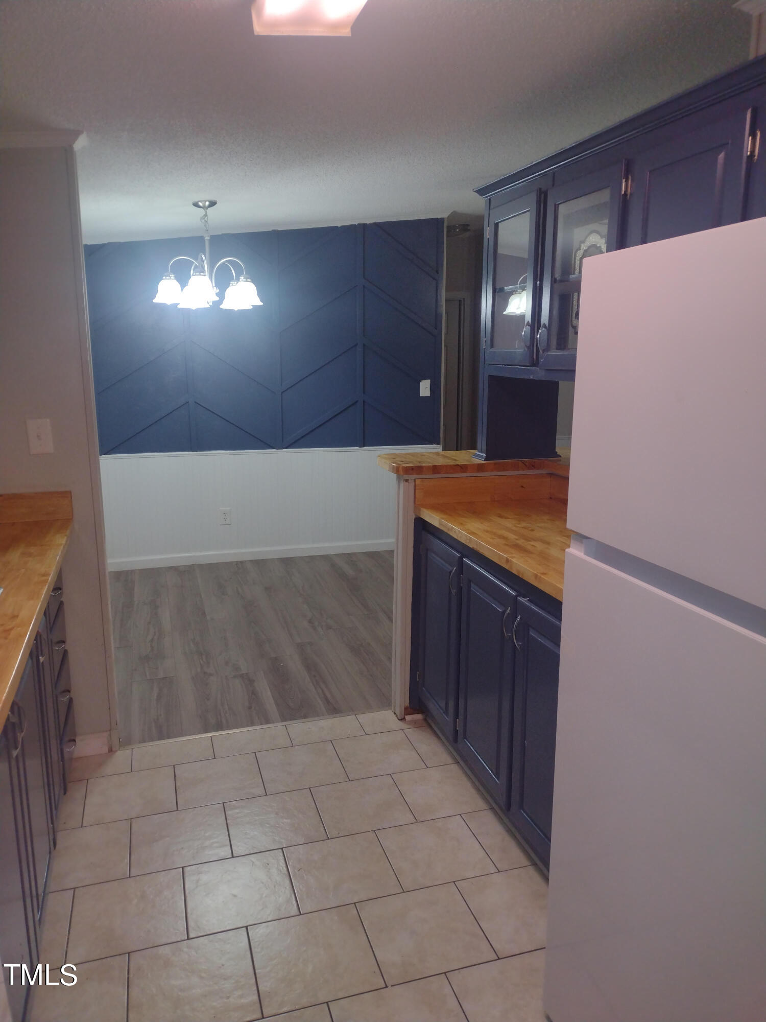 437 West Northpoint Road Spring Lake, NC 28390 - Photo 9 of 27 a kitchen with a refrigerator and cabinets